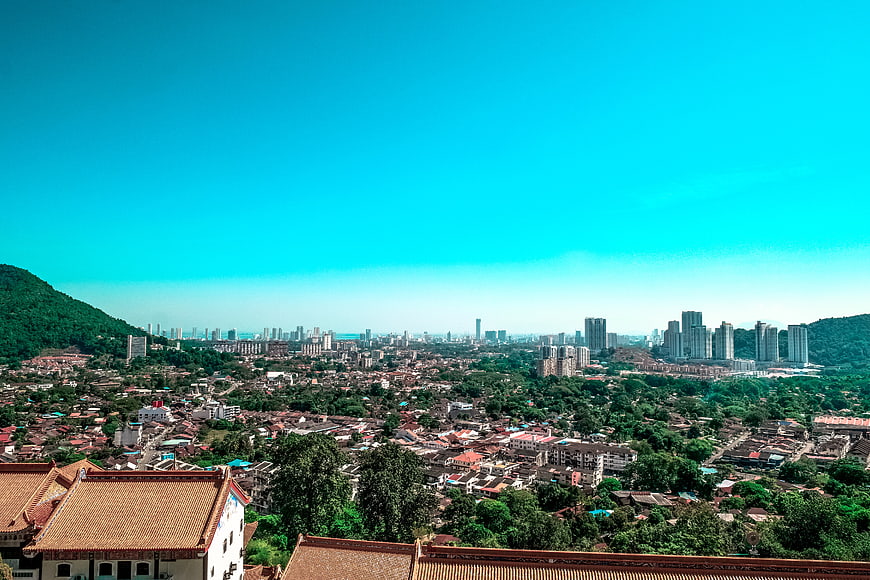 Cityscape with traditional roofs and modern skyline