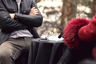 Two people playing chess outdoors in a park