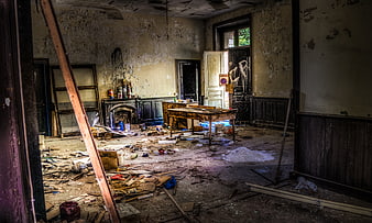 Abandoned Interior Room with Debris and Peeling Walls