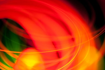 Abstract Red and Yellow Light Burst with Green Accents
