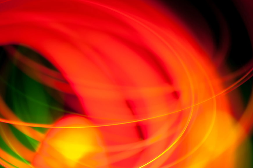 Abstract Red and Yellow Light Burst with Green Accents