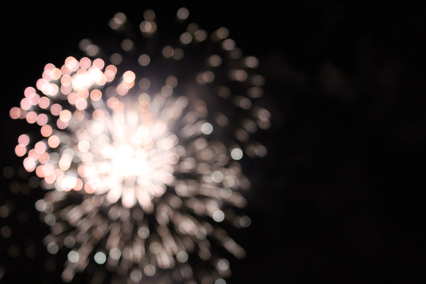 Abstract Bokeh Fireworks Explosion on Black Background
