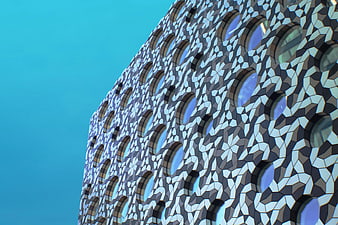 Modern geometric building facade with circular windows