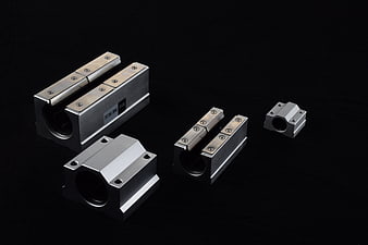 Linear Motion Guide Rails and Blocks on Black Background