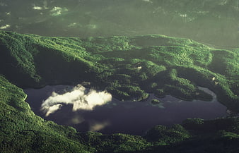 Aerial View of Lush Green Mountain Lake with Cloud Reflection