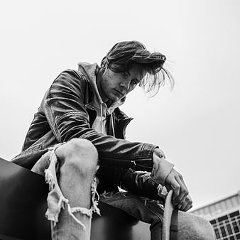 Moody Black and White Portrait of Man in Leather Jacket