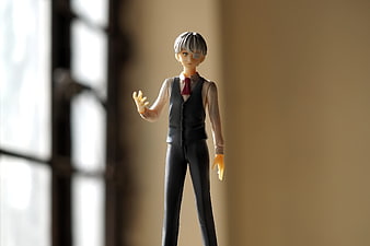 Anime Figure of Young Man in Black Vest and Red Tie