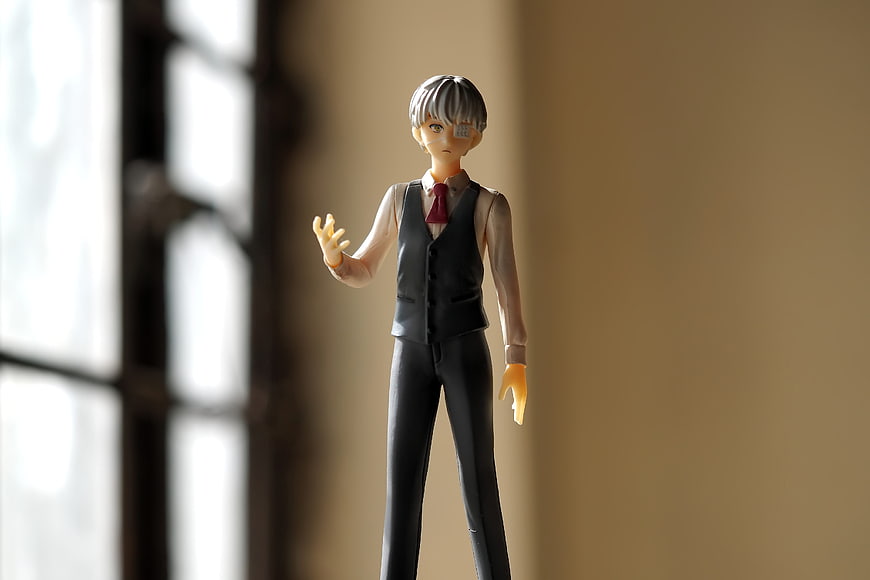 Anime Figure of Young Man in Black Vest and Red Tie