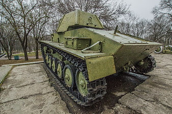 Vintage Green Military Tank on Concrete Display