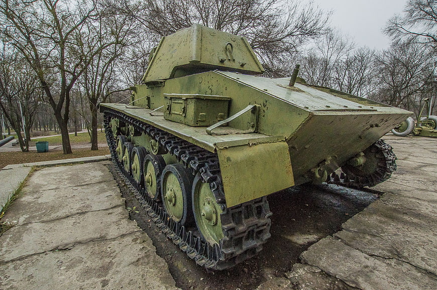 Vintage Green Military Tank on Concrete Display