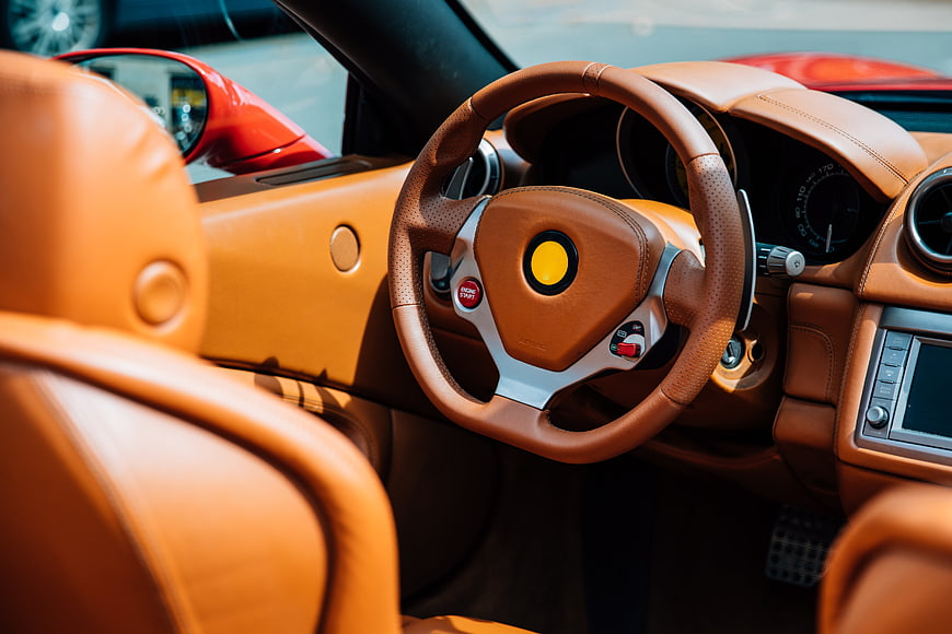 Luxury Sports Car Interior with Tan Leather Steering Wheel