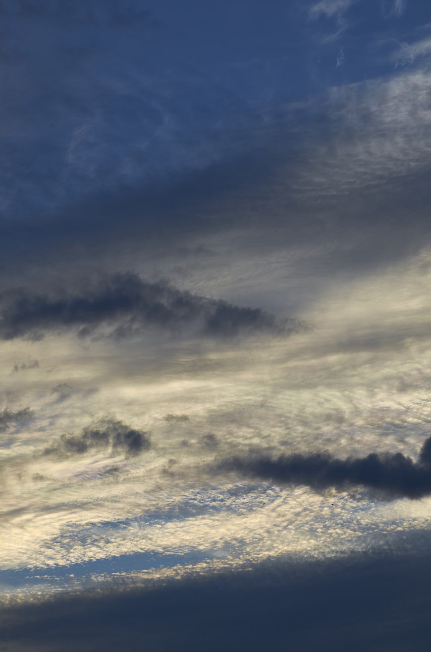 Dramatic layered clouds in blue and grey sky