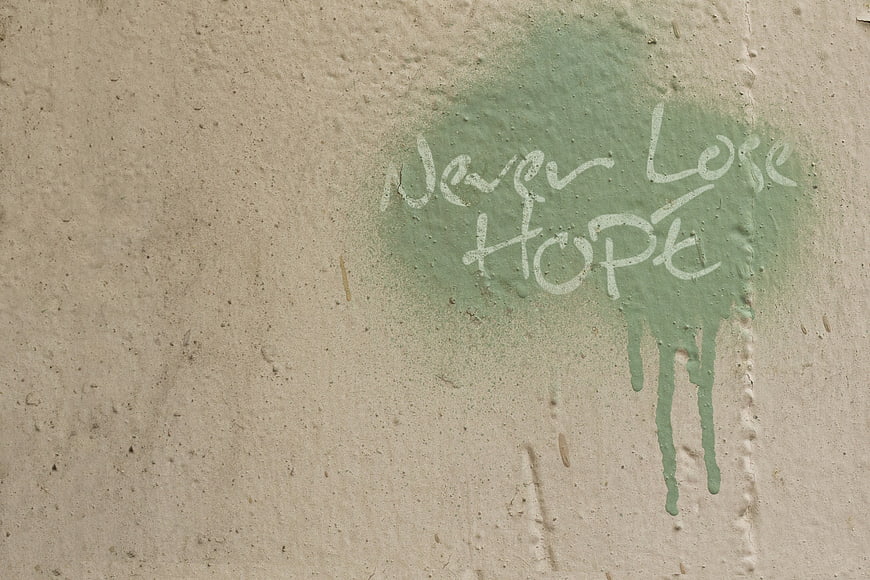Never Lose Hope Graffiti on Textured Concrete Wall