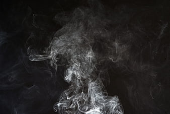 White Smoke Swirls on Black Background Abstract Texture
