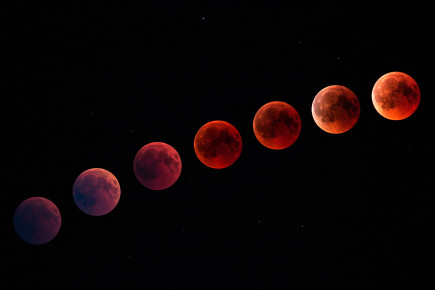 Blood Moon Eclipse Sequence Against Black Night Sky