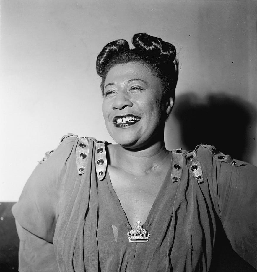 Vintage black and white portrait of smiling Ella Fitzgerald