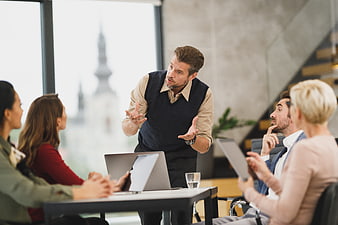 Business Team Meeting Discussion in Modern Office