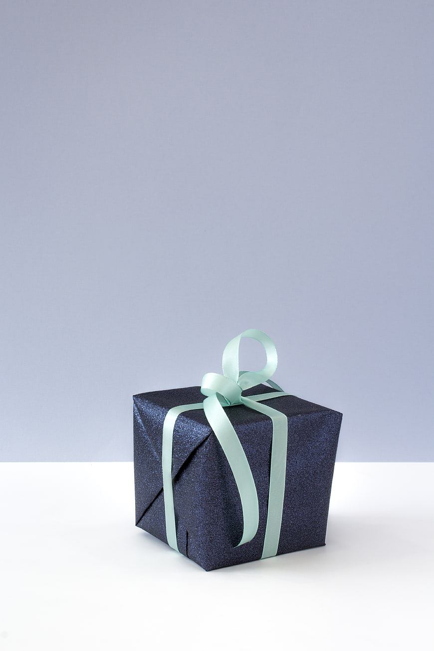 Dark Blue Glitter Gift Box with Mint Ribbon on White Background