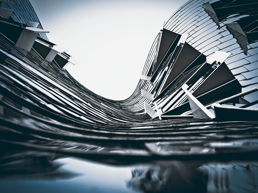 Abstract Modern Architecture with Curved Glass Facade and Reflection