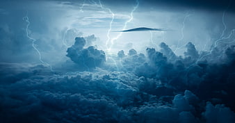 Dramatic Blue Lightning Storm Over Clouds