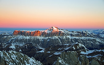Snow-Capped Mountain Peak at Sunset with Pink Sky