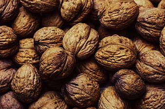 Close-up texture of whole walnuts in shell