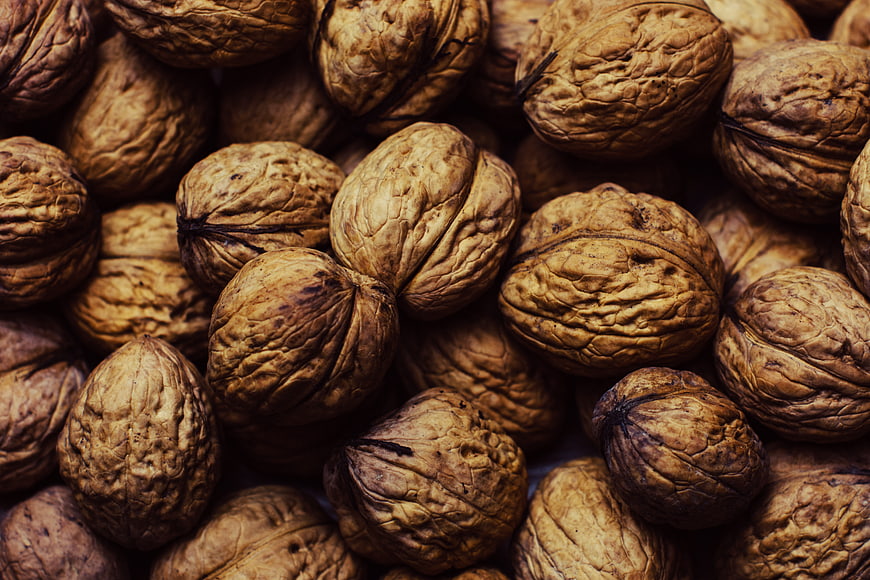 Close-up texture of whole walnuts in shell
