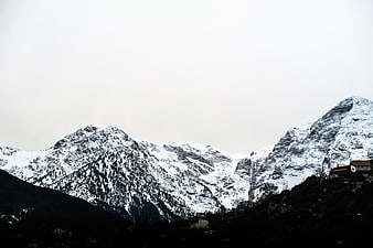 Snow-Capped Mountains with Village in Winter Landscape