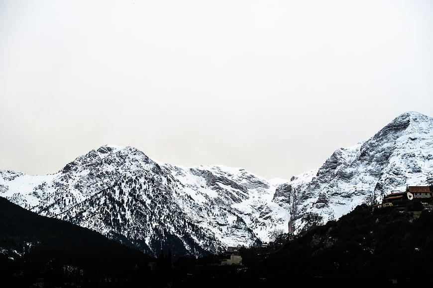 Snow-Capped Mountains with Village in Winter Landscape