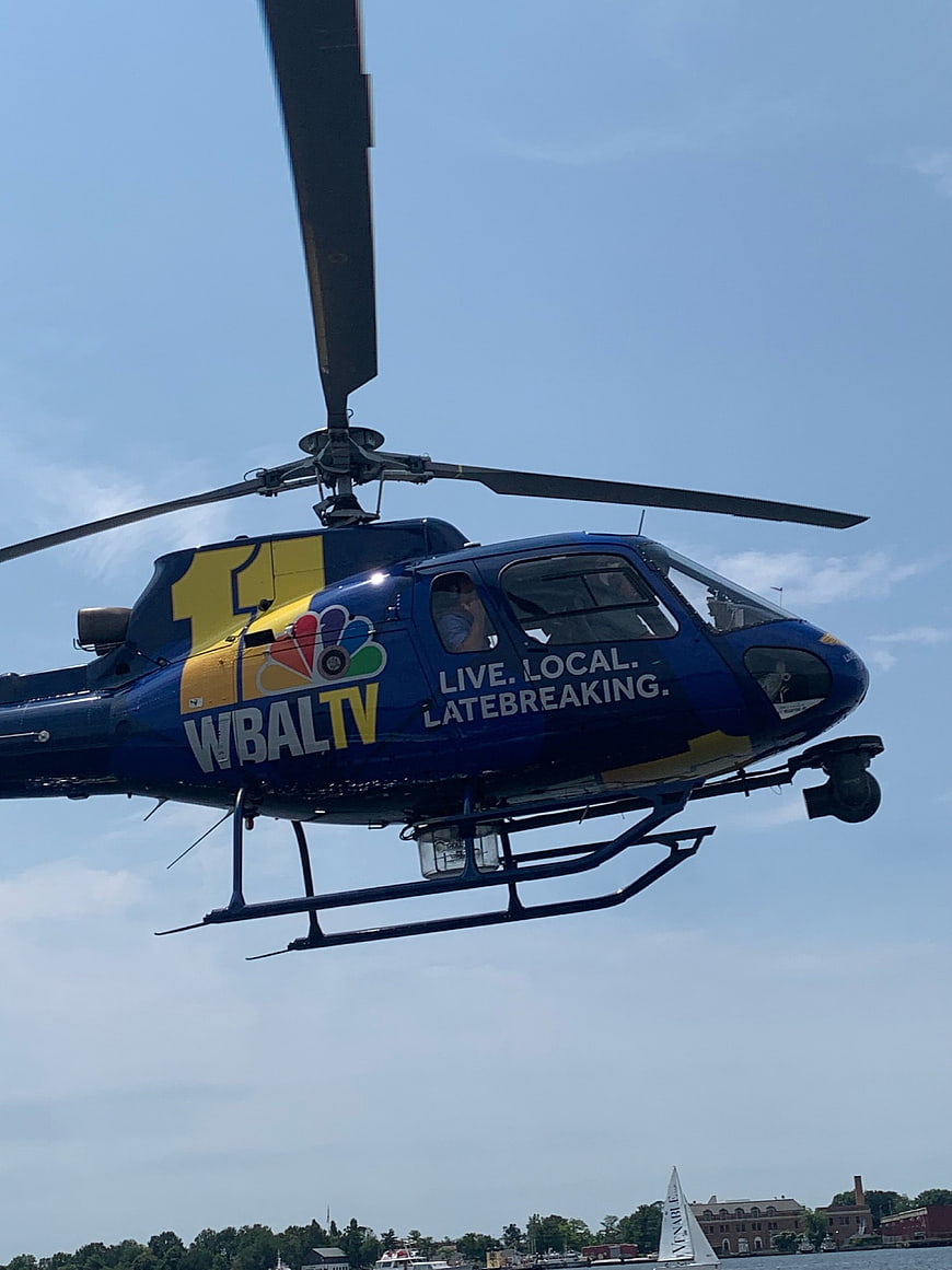 Blue WBALTV News Helicopter Flying Over Water