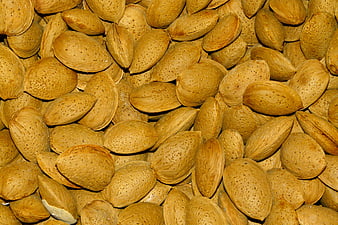 Close-up texture of raw almonds filling the frame