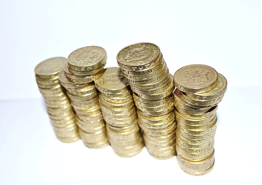 Stacks of Gold Coins on White Background