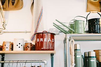 Rustic Kitchen Shelf with Bread Bin and Green Watering Cans
