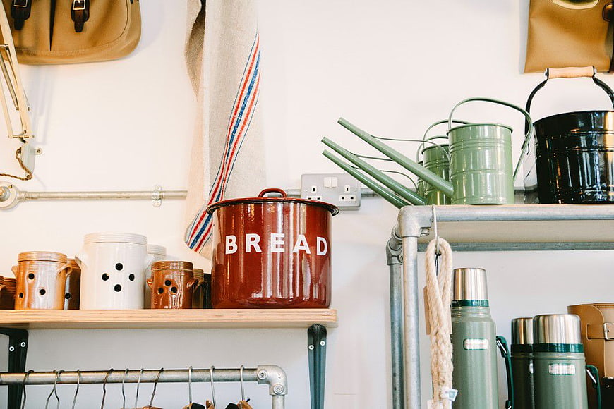 Rustic Kitchen Shelf with Bread Bin and Green Watering Cans