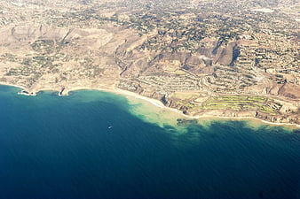 Aerial view of Malibu coastline with golf course and ocean
