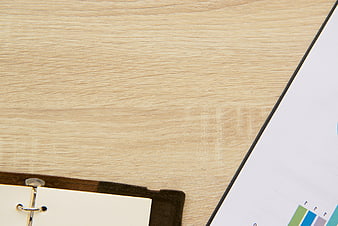 Minimalist Office Desk with Binder and Financial Chart