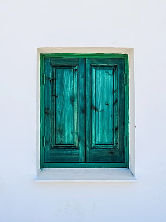 Green Wooden Window Shutters on White Wall