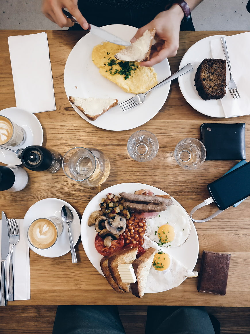 Top View of Full English Breakfast and Coffee on Wooden Table