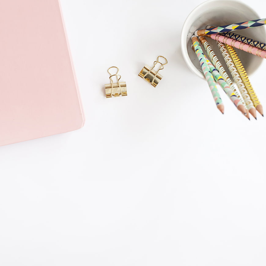 Minimalist Pink Notebook and Patterned Pencils Flat Lay