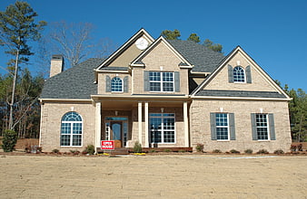 New Brick Suburban Home With Open House Sign