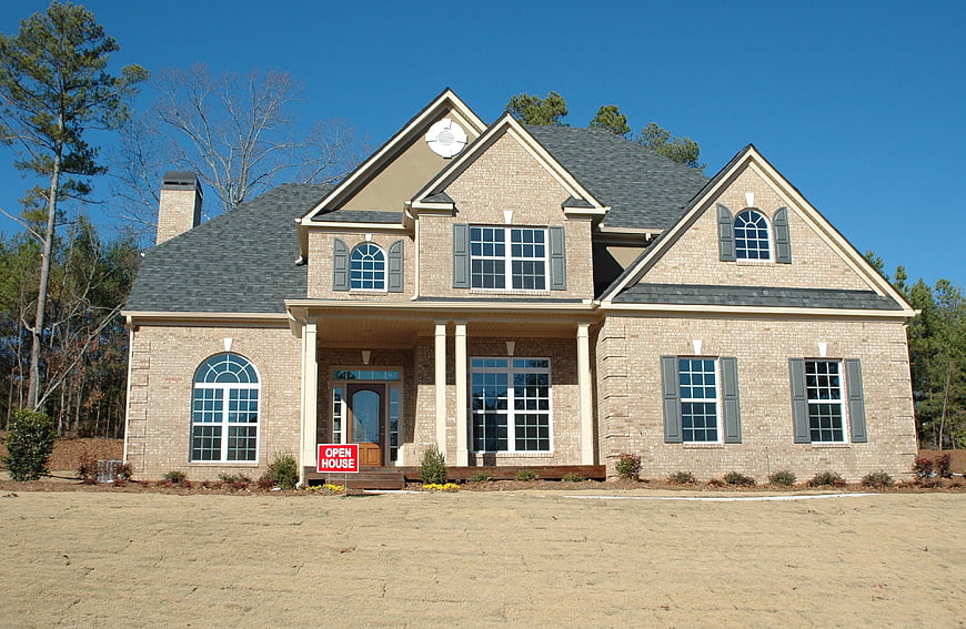New Brick Suburban Home With Open House Sign
