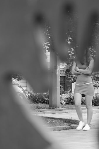 Woman in Dress Seen Through Blurred Foreground