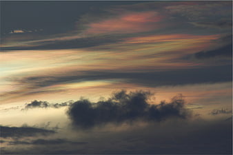 Dramatic sunset sky with colorful clouds and dark silhouettes