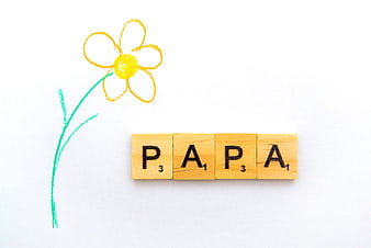 Papa Scrabble Tiles With Childlike Flower Drawing On White Background