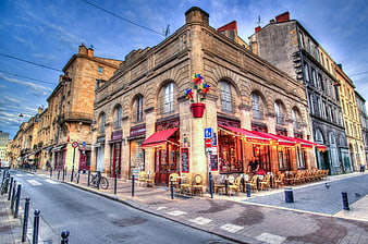 Colorful pinwheel on historic European street corner cafe