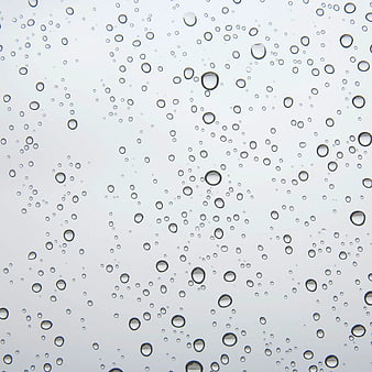 Raindrops on Glass Window Background