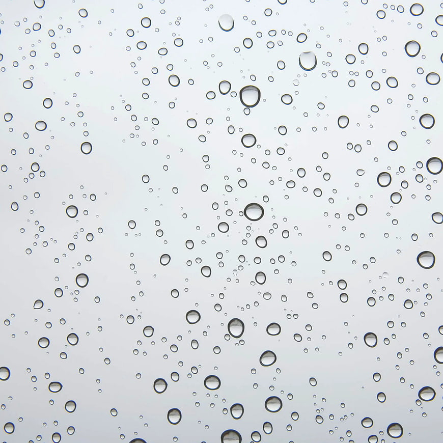 Raindrops on Glass Window Background