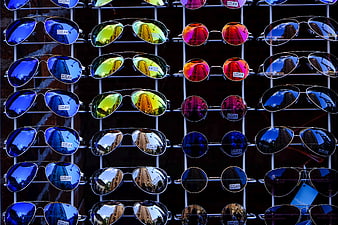 Colorful Sunglasses Display with City Reflections