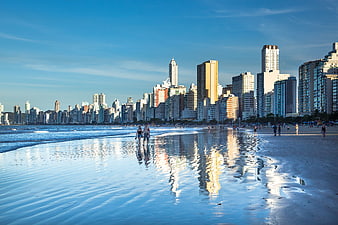 Reflective Beach Skyline with City Buildings