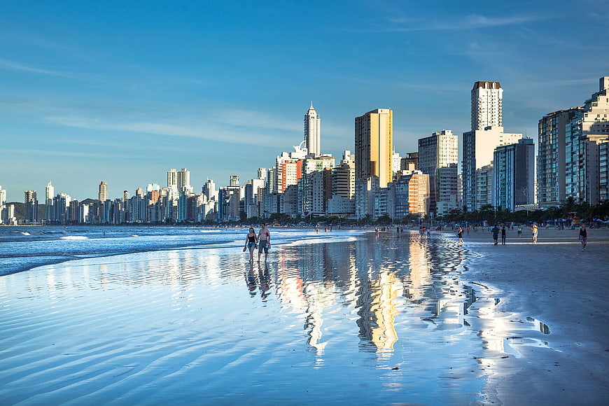 Reflective Beach Skyline with City Buildings